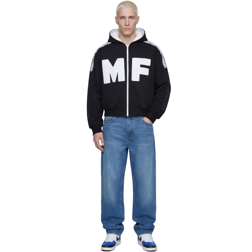 Person wearing a black hoodie with 'MF' logo and blue jeans on a white background