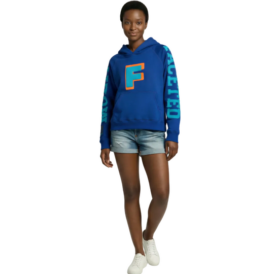 Person wearing a blue oversized hoodie with a large orange 'F' on a white background