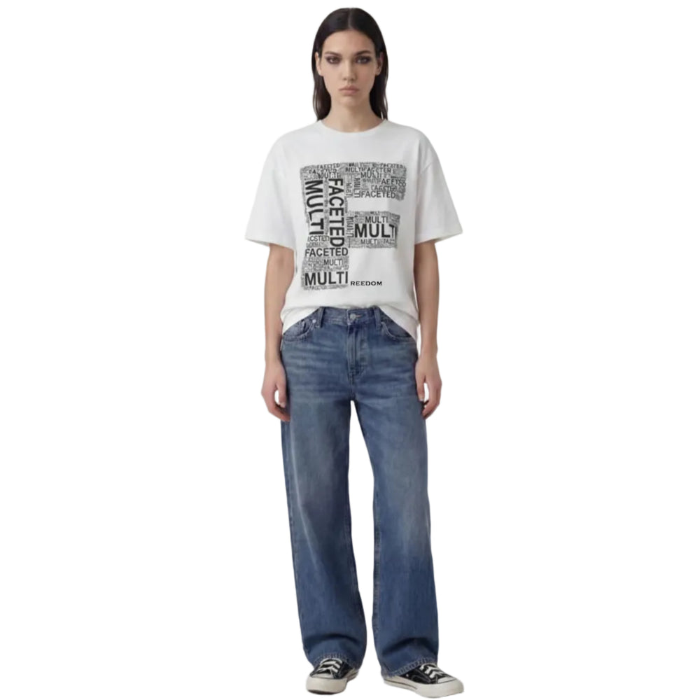 Person wearing a white t-shirt with text and blue jeans on a white background