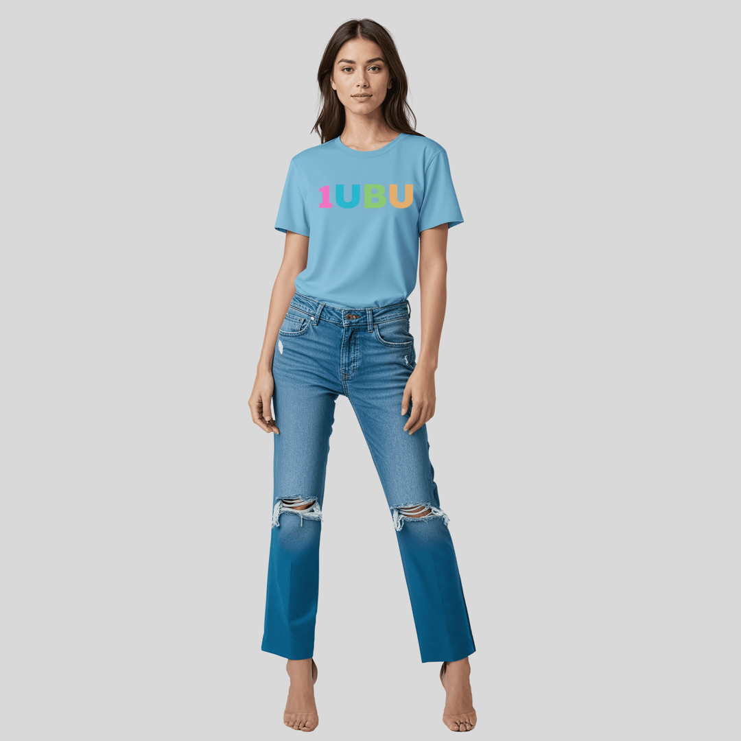 Woman wearing a blue t-shirt with '1UBU' logo and ripped jeans on a gray background