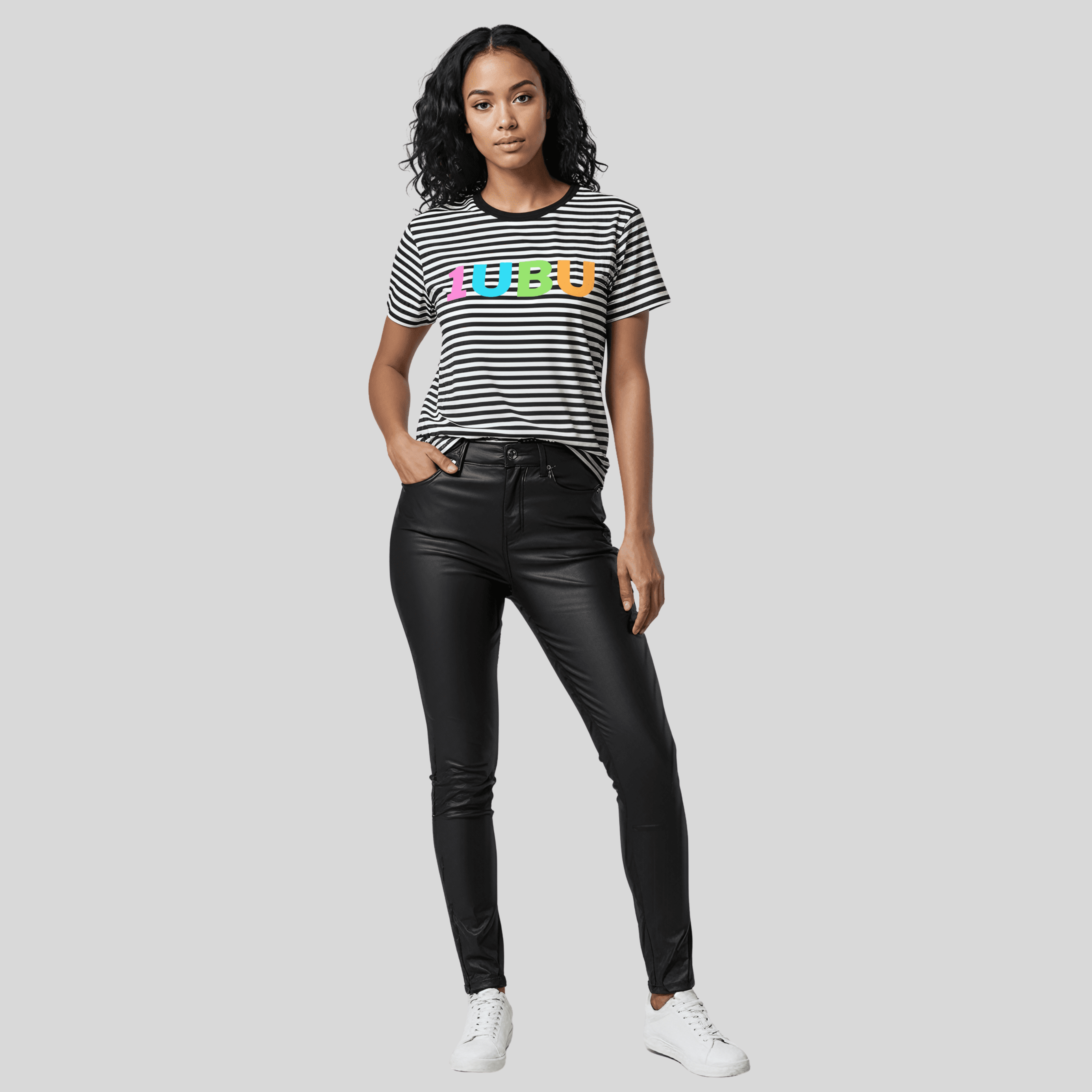 Woman wearing black legging and a black and white stripe tshirt.