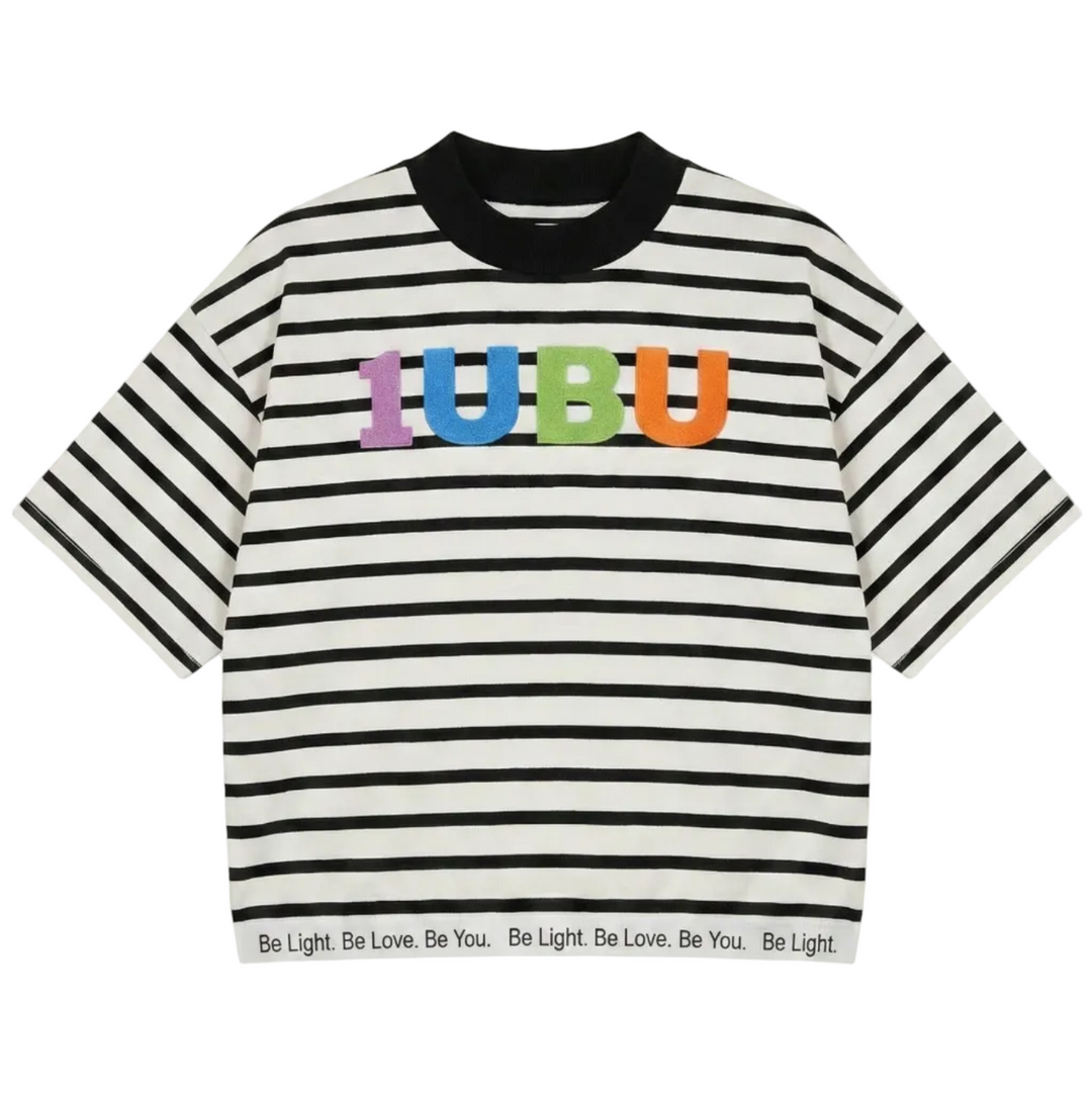 Black and white striped t-shirt with colorful text on a white background