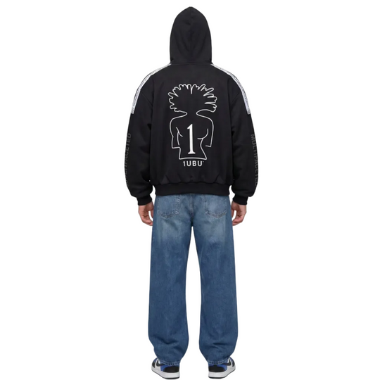 Person wearing a black hoodie with a logo on the back against a white background