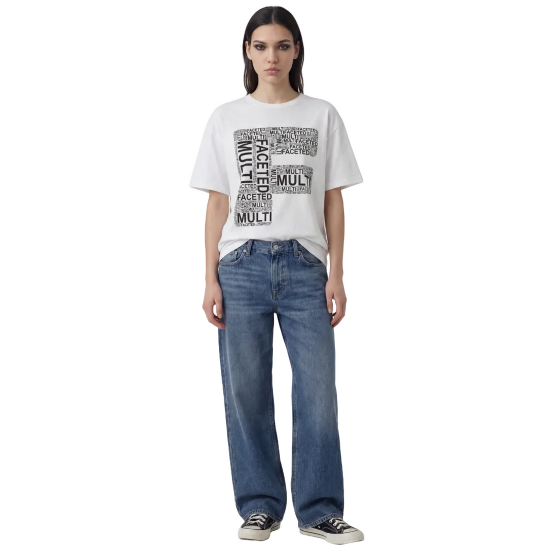 Person wearing a white t-shirt with text and blue jeans on a white background