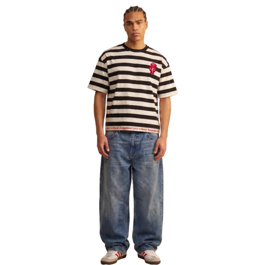 man wearing 1UBU strpe Tee